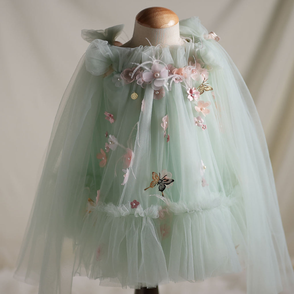 Front view of mint green butterfly fairy dress for baby girls