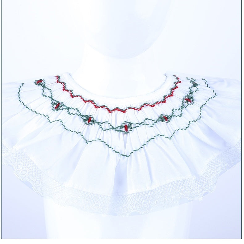 close up of hand smocked ruffle collar with lace trim