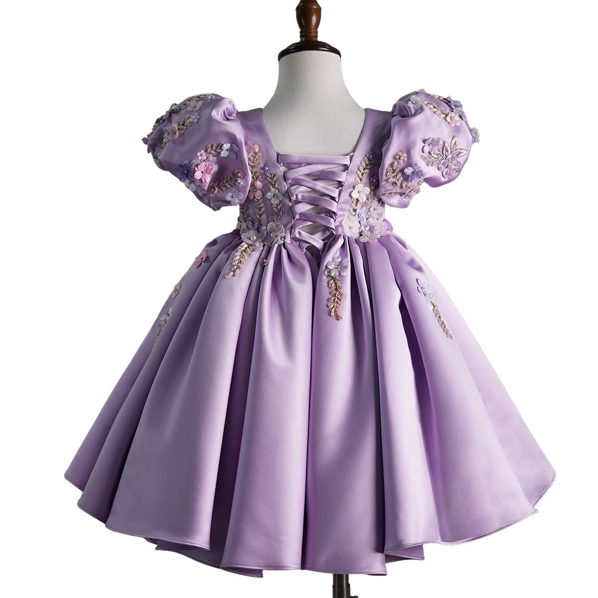 Back view showing lace-up detail on luxury lavender dress