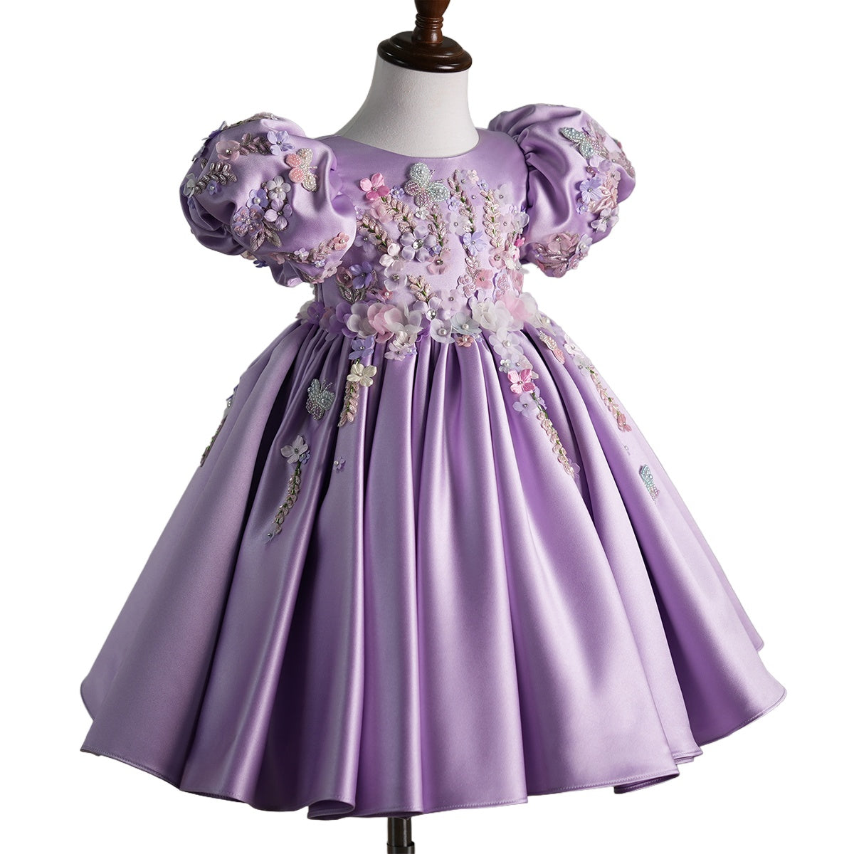 Front view of lavender luxury handcrafted dress for baby girl