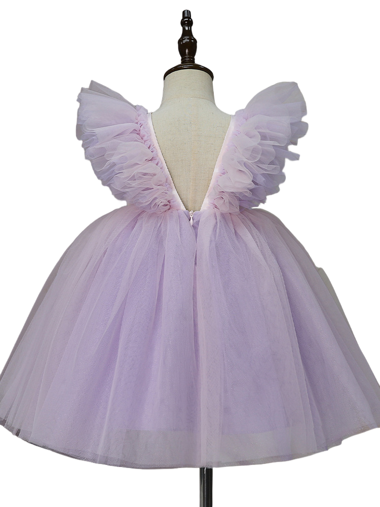Back view showing V back and ruffle wing shoulders on lilac dress