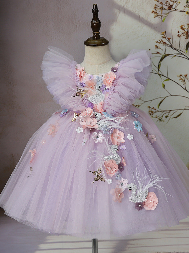 Full front view of lilac swan fairy tulle dress with ruffle shoulders