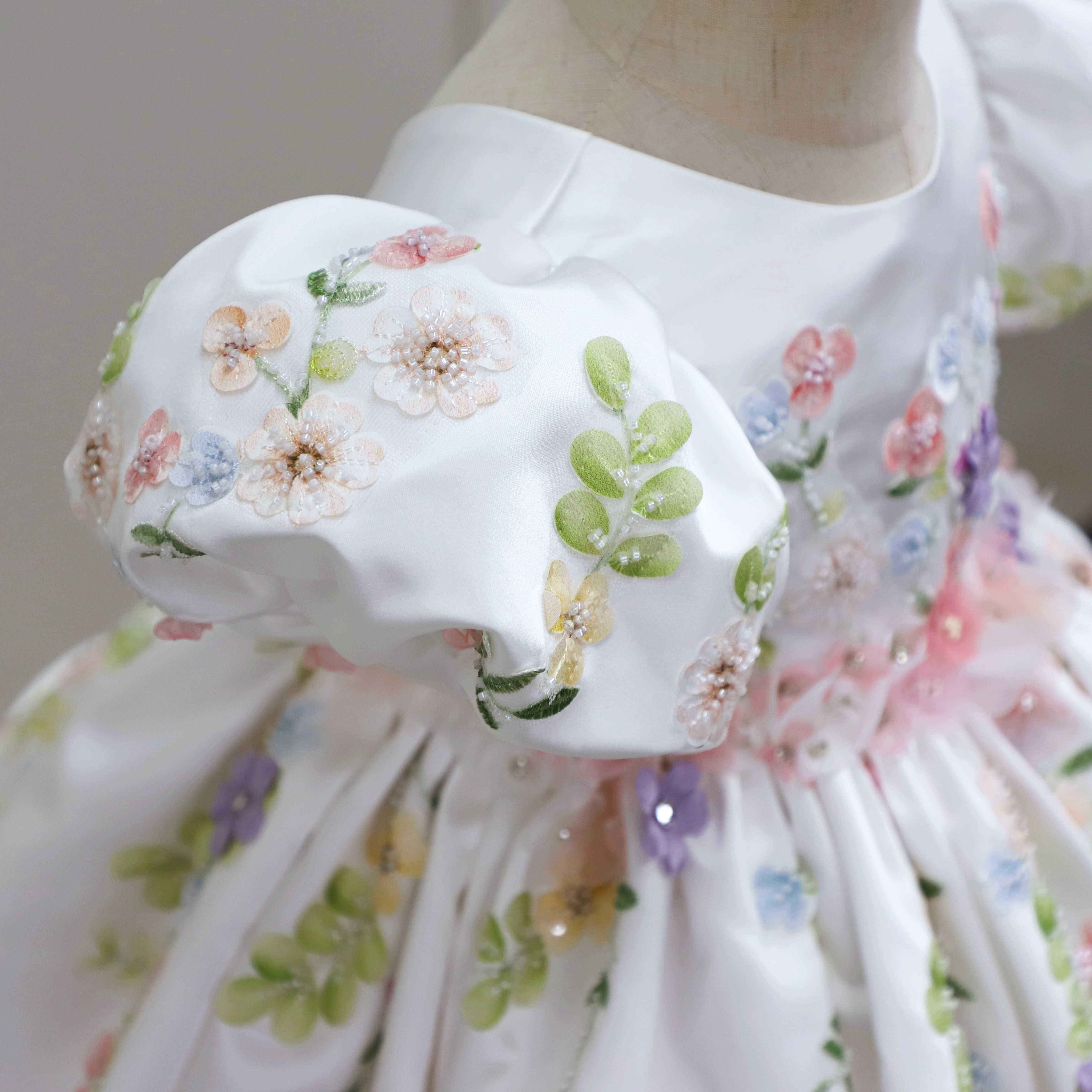 Ivory 3D floral dress, bodice front view, puff sleeves