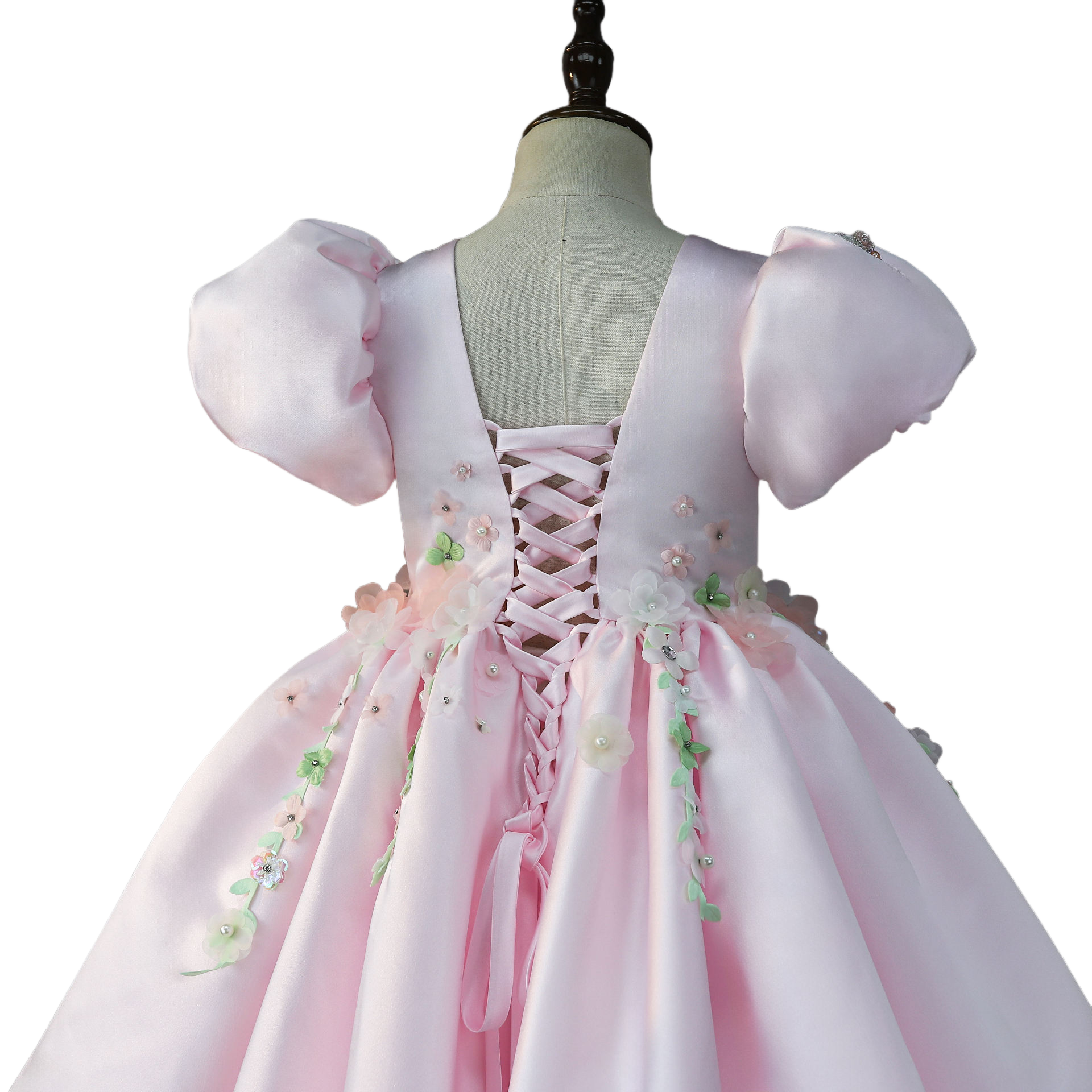 Pink dress back bodice close-up with floral appliqués