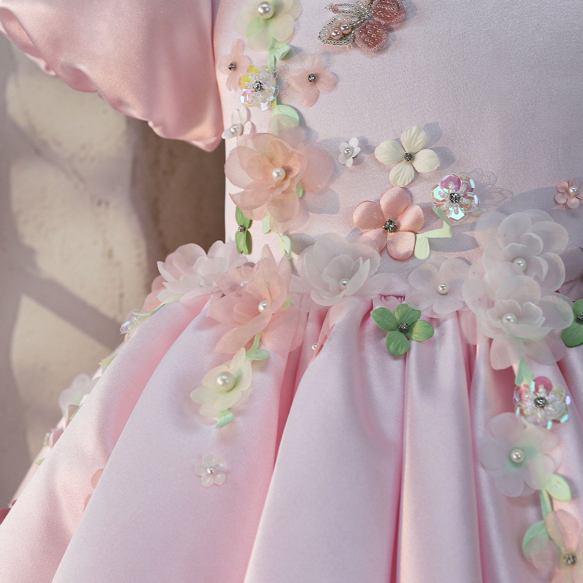 Pink 3D floral bodice with pearls and crystals, close-up