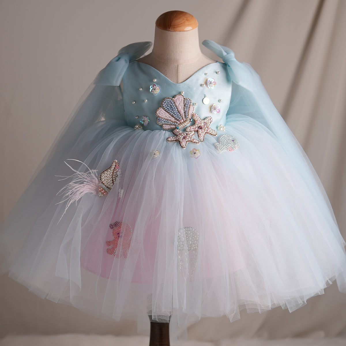 Full front view of aqua blue mermaid princess dress with layered tulle