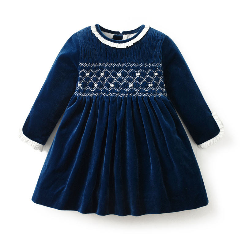 front view of navy velvet hand-smocked dress with ruffle collar