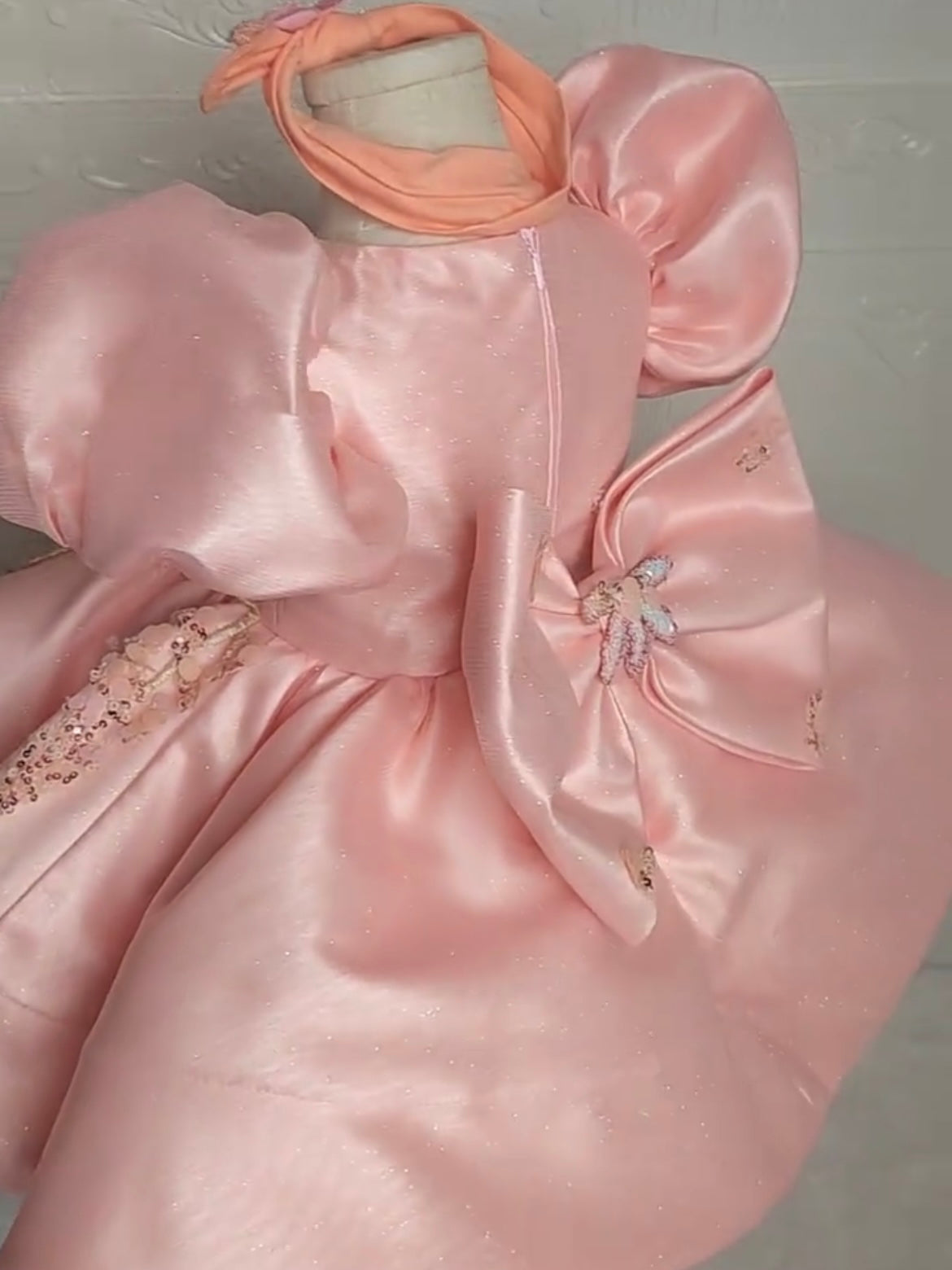 back view with big bow on pink butterfly dress