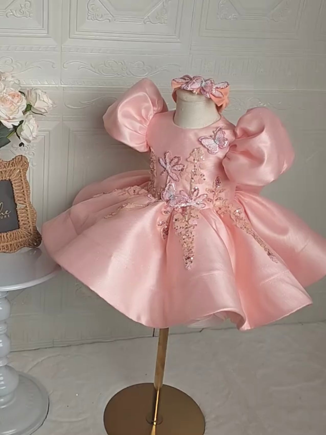 front view of pink butterfly party dress with puffy sleeves
