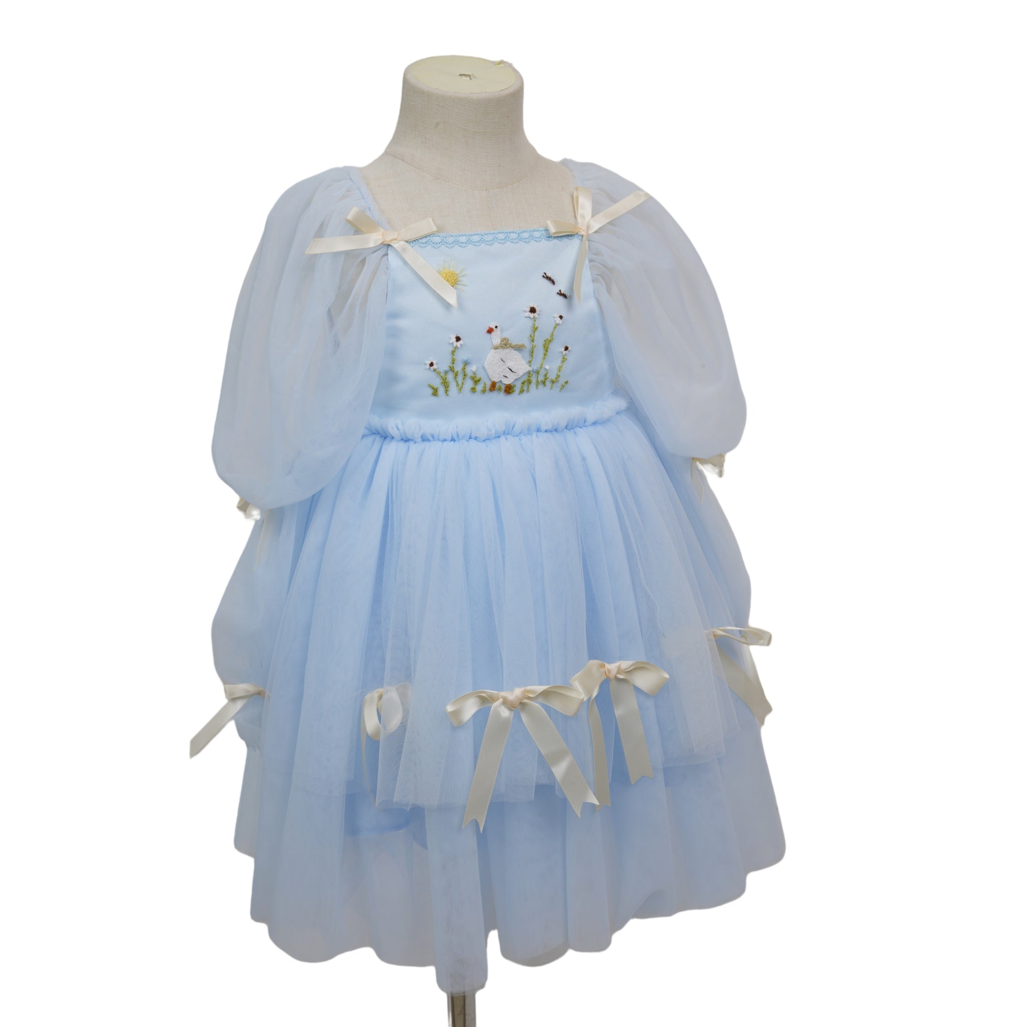 Angle view showing puff sleeves and cream ribbon bows